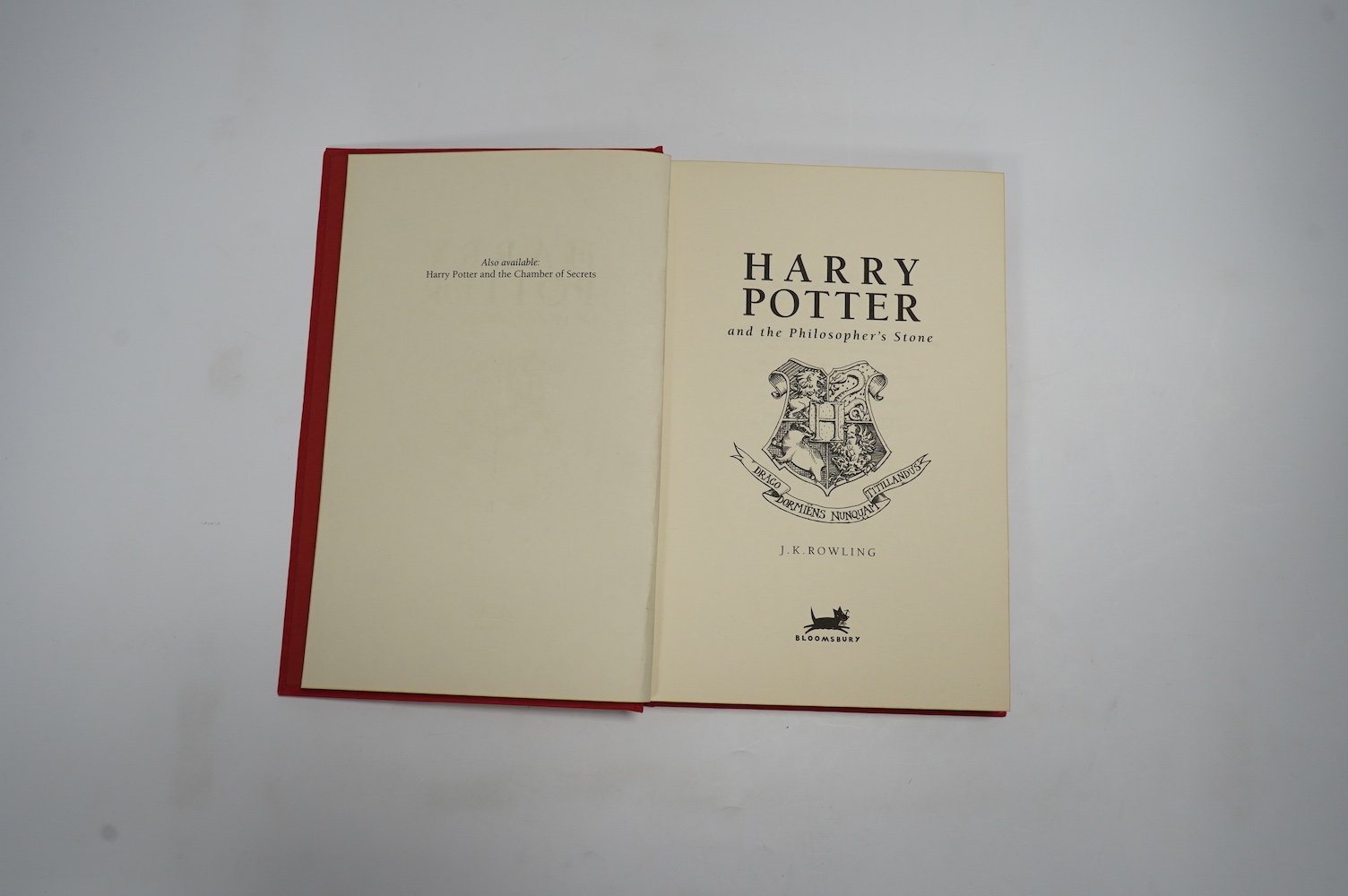 Rowling, J.K. - Harry Potter and the Philosopher's Stone. (De Luxe Edition). armorial half and title pages. publisher's gilt red cloth with mounted coloured illus. on upper cover, ge. and red e/ps. 1999; Rowling, J.K. -